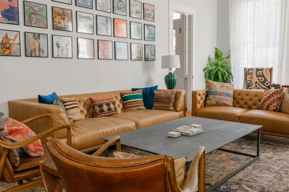 Living room seating and piano at The Mazant