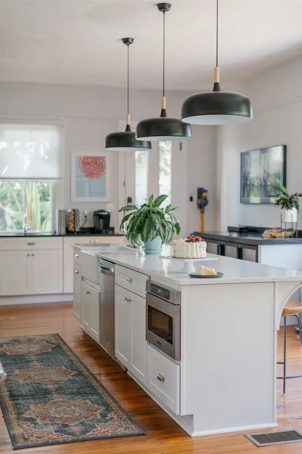 Kitchen with white cabinetry and appliances