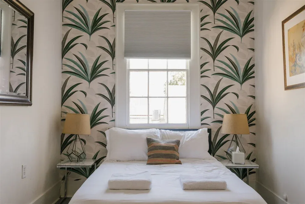 Bedroom with botanical wallpaper