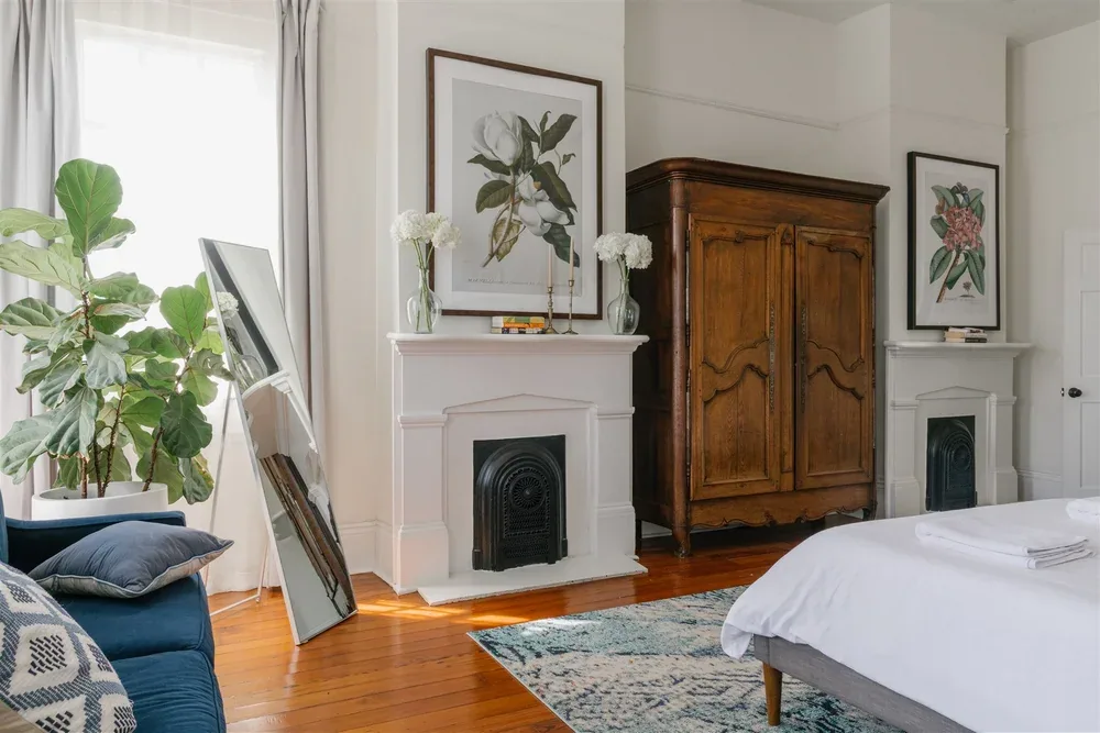 Bedroom with armoire and seating