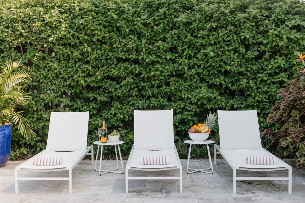 Pool yard with white loungers