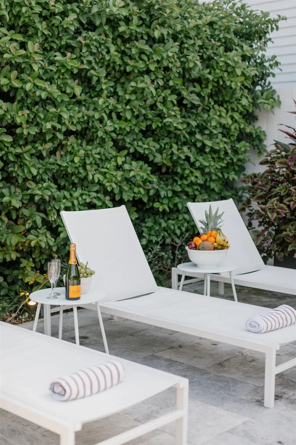 Pool yard with loungers and spa at The Mazant